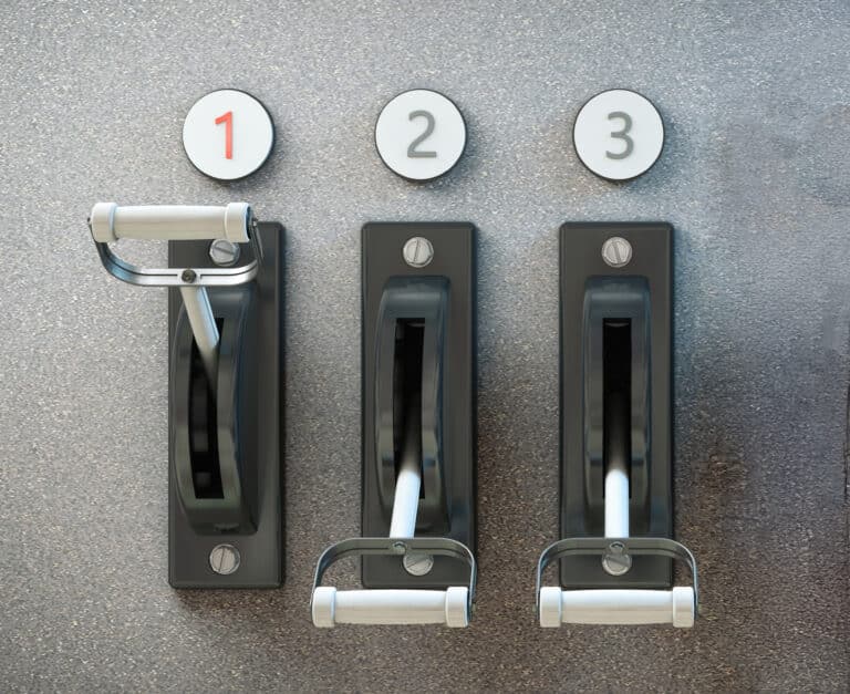 3 levers next to each other in a concrete wall